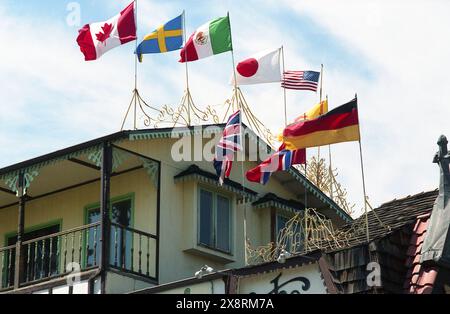 Colorado, U.S.A., approx. 1987. Exterior view of a local restaurant, with flags of different nations waving on top. Stock Photo