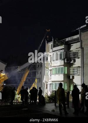 Tongling City, China. 27th May, 2024. Search and rescue operations are underway at the site of a building collapse in Datong Township of Tongling City, east China's Anhui Province, on May 27, 2024. Five people remain missing after a residential building partially collapsed Monday afternoon in the city of Tongling, east China's Anhui Province, according to local authorities. The western side of the five-story building, located in Datong Township in Jiaoqu District, collapsed at around 1:40 p.m. Monday, the district government confirmed. The government said an initial investigation Credit: Xinhu Stock Photo