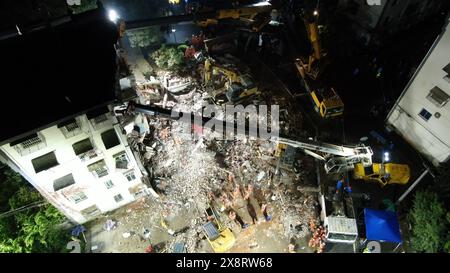 Tongling City, China. 27th May, 2024. An aerial drone photo taken on May 27, 2024 shows rescuers carrying out search and rescue operations at the site of a building collapse in Datong Township of Tongling City, east China's Anhui Province. Five people remain missing after a residential building partially collapsed Monday afternoon in the city of Tongling, east China's Anhui Province, according to local authorities. The western side of the five-story building, located in Datong Township in Jiaoqu District, collapsed at around 1:40 p.m. Monday, the district government confirmed. Th Credit: Xinhu Stock Photo