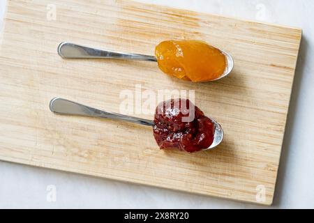 Spreadable Fruit with Mango, Raspberry, Pomegranate and Pineapple on Spoon. Ready to eat. Stock Photo