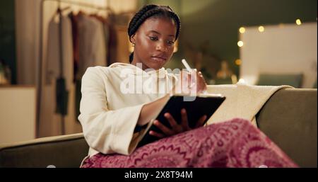 Relax, drawing and black woman on couch with tablet for creative ideas, work from home and fashion. Small business, software and girl on sofa with Stock Photo