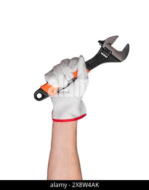 Hand holding metallic wrench in construction work. Industrial manual tool for repair and maintenance. Isolated closeup of handyman with adjustable spa Stock Photo
