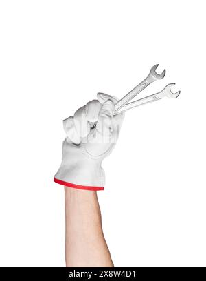 Isolated spanner wrench in hand. Industrial repair tool for mechanical work. Glove and steel construction equipment. Technician holding chrome hardwar Stock Photo