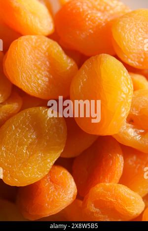Dried fruits. Dried apricots. Dried apricots in close-up on a white plate. Stock Photo