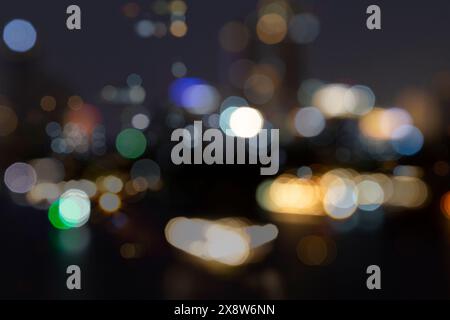 Blurred bokeh city lights, abstract night scene. Abstract high resolution full frame background with copy space. Stock Photo