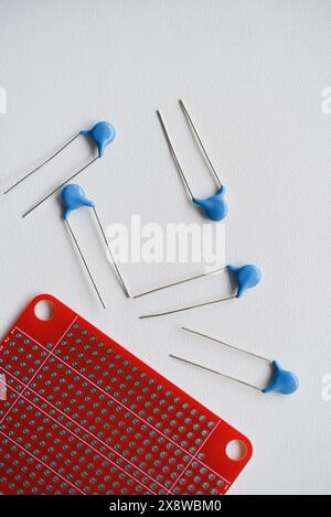 Red printed circuit board and chips and radio components. Capacitors and transistors. Stock Photo