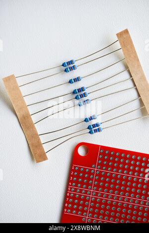 Red printed circuit board and chips and radio components. Capacitors and transistors. Stock Photo