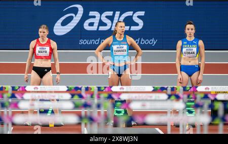 Verena Mayr of Austria, Saga Vanninen of Finland and Yuliya Loban of Ukraine competing in the 60m hurdle pentathlon at the World Athletics Indoor Cham Stock Photo