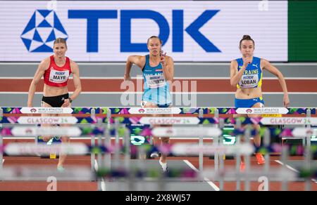 Verena Mayr of Austria, Saga Vanninen of Finland and Yuliya Loban of Ukraine competing in the 60m hurdle pentathlon at the World Athletics Indoor Cham Stock Photo