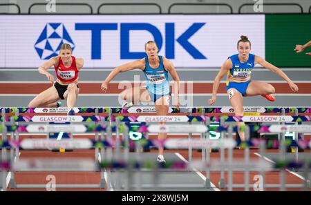 Verena Mayr of Austria, Saga Vanninen of Finland and Yuliya Loban of Ukraine competing in the 60m hurdle pentathlon at the World Athletics Indoor Cham Stock Photo