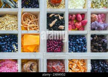 A wooden box filled with a variety of fruits and vegetables. The box is filled with different types of fruits, vegetables, spices, ingredients includi Stock Photo
