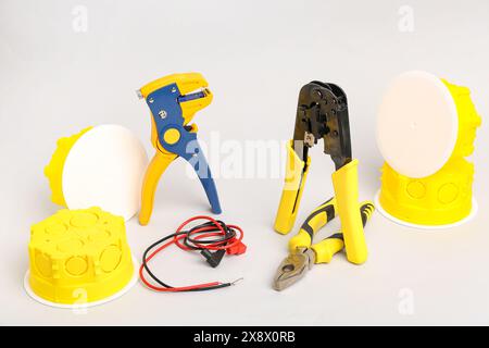 Electrician's tools on light background Stock Photo