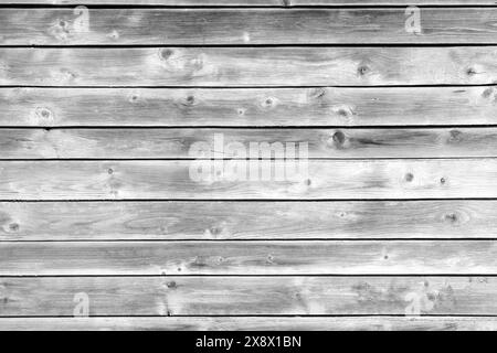 A wooden background with a few small black dots. The background is mostly white and the dots are scattered throughout Stock Photo