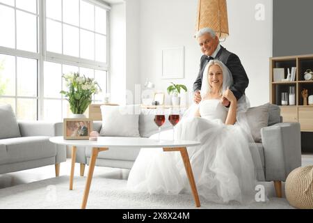 Mature couple celebrating their wedding anniversary at home Stock Photo