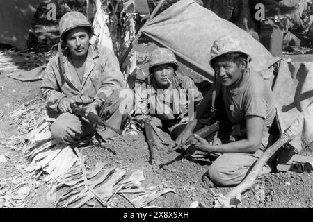 Navajo code talkers with the first assault waves of the U.S. Marine Corps to hit the beach on Saipan in the North Mariana Islands in 1940s during World War II. Stock Photo
