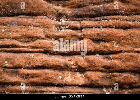 Multiple layers of eroded and striated sandstone Stock Photo