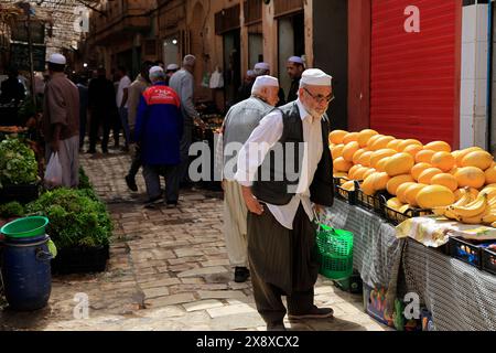 Vegetable and fruit sellers in Ghardaia market. Mazb Valley.Ghardaia Province.North Sahara.Algeria Stock Photo