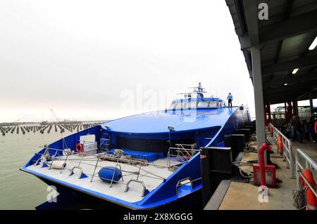 Turbojet ferries to Macau docking at the Macau ferry terminal in Sheung Wan, Hong Kong. Stock Photo