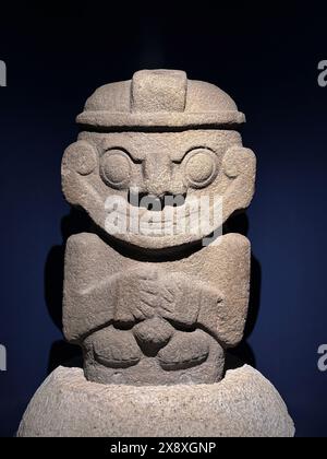 Stone effegy of a man found in tombs of San Agustin dating back 2000 years  now on display at the Gold Museum of Bogota - Colombia Stock Photo