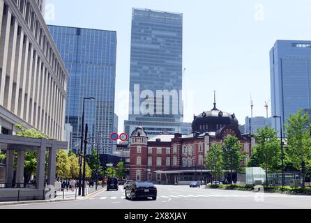 Old &  New. The Marunouchi building of the Tokyo station with modern skyscrapers behind it. Tokyo, Japan. Stock Photo