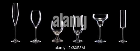 Set of different empty glasses for drinks and cocktails on black background with clipping path. Stock Photo