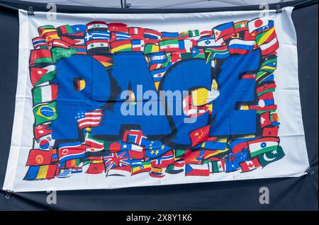 Peace flag with the representation of flags from all over the world, painted on a white canvas Stock Photo