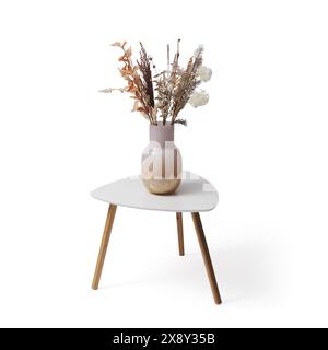 Small decorative table with flower pot and dried flowers, isolated on white background Stock Photo