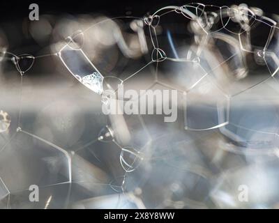 Abstract white soap foam bubbles texture background. Bubble texture isolated on black background for composition. Close-up photo. Stock Photo