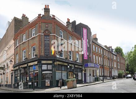 Greenwich, London, UK. Crooms Hill. Shows the Rose and Crown pub (left) and Greenwich Theatre (centre). Elegant Georgean houses beyond. Stock Photo