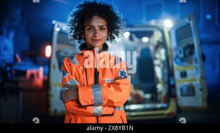 Portrait of Beautiful, Multiethnic, Female Paramedic Specialist on Late Night Shift. Heroic Empowering Woman Smiling and posing for Camera, Reporting for Duty to Save Lives and Treat Emergencies Stock Photo
