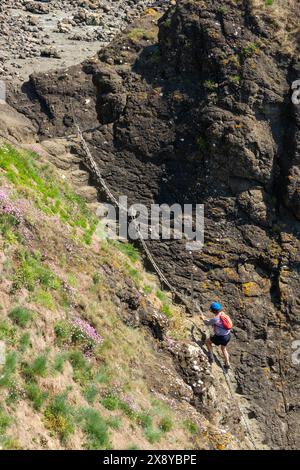 One person on the famous Elie Chain Walk Stock Photo
