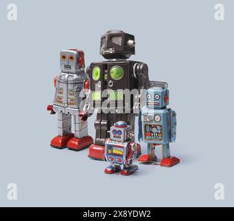 Vintage tin toy robots standing together, vintage mechanical toys and amusement concept, copy space Stock Photo