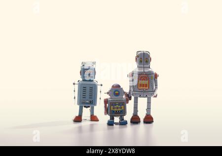 Vintage tin toy robots standing together, vintage mechanical toys and amusement concept, copy space Stock Photo
