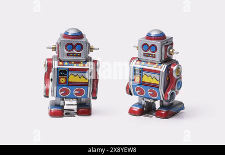 Funny cute tin toy robots on white background, vintage toys concept Stock Photo