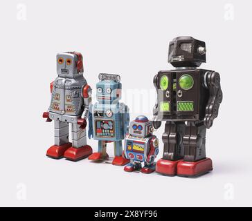 Funny cute tin toy robots standing together on white background Stock Photo
