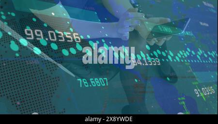 Image of data processing, spinning globe over mid section of caucasian woman using a smartphone Stock Photo