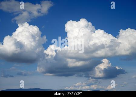 large spring clouds, cumulus clouds over mountains of Bavarian Forest, Germany Stock Photo