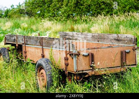 old trailer in tall grass Stock Photo