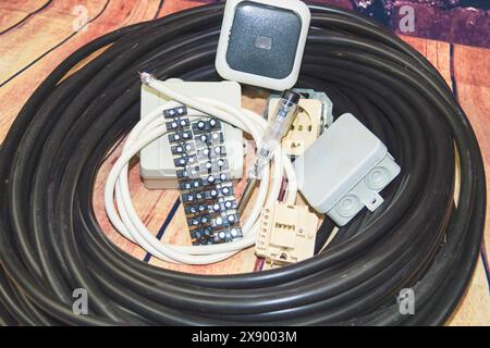 Power cable, junction box, socket outlet and switch, symbol image for electricians Stock Photo
