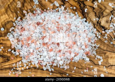 Himalayan salt on a wooden board Stock Photo