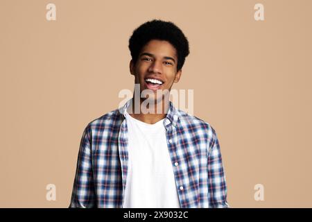 Afro Teenage Guy Posing with Hands in Pockets Stock Photo