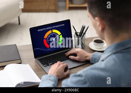 Website speed optimization. Man using laptop at table, closeup Stock Photo