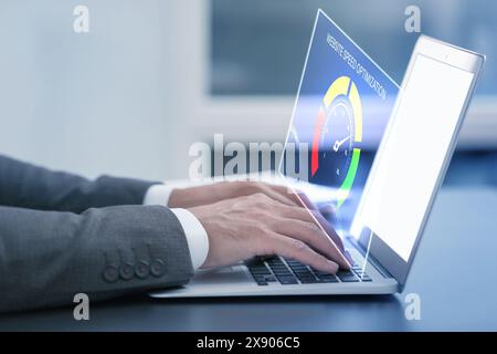 Website speed optimization. Man using laptop at table, closeup. Virtual screen over device Stock Photo