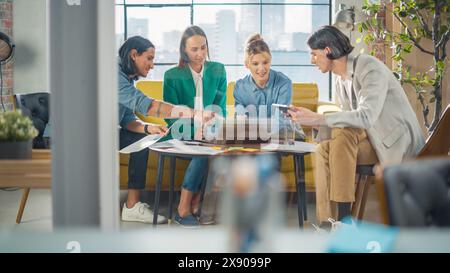 A Group of Multiethnic Enthusiastic Students Comparing Research Findings in University Study Room. Young Post-Doctorate Researchers Meeting to Analyze Study Results and Discuss Conclusions Stock Photo