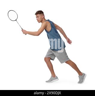 Young man playing badminton with racket on white background Stock Photo