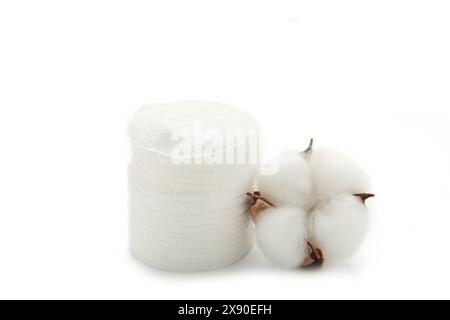 Make up cotton pad stack pack with flower isolated on background. Top view Stock Photo