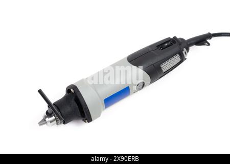 High-angle shot of a mini drill with the key securely inserted into the chuck, ready for use. Stock Photo