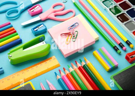 Different stationery on blue background, flat lay with space for text. Stock Photo