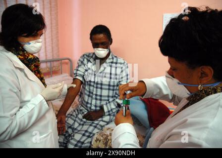 24 July 2007 - South Africa. Cape Town. Brooklyn Chest Hospital  Extreme drug resistant XDR TB tuberculosis nurses treating patient isolation ward  drugs health treatment poverty medication     Photo Credit: Eric Miller / african.pictures Stock Photo