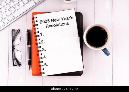 2025 New Year's Resolutions text on notepad Stock Photo